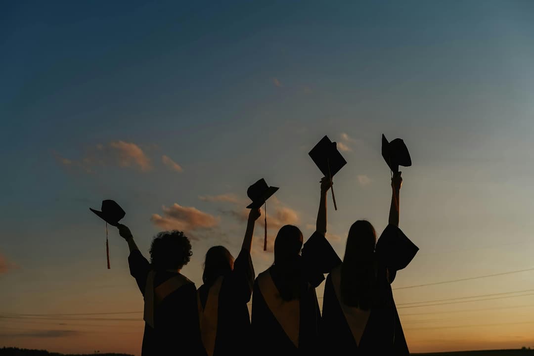 Students celebrating university acceptance letters